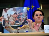 Belarus opposition leader Svetlana Tikhanovskaya holds up a photograph as she addresses members of the EU parliament at the EU headquarters in Brussels on September 21, 2020. European foreign ministers welcomed Belarus opposition leader Svetlana Tikhanovskaya to Brussels as they prepare EU sanctions to support her battle against the Minsk regime. The former Soviet republic has been convulsed by unprecedented demonstrations against President Alexander Lukashenko since he was returned to power in a disputed A