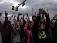Supporters cheer as Marine One carrying the US President leaves Walter Reed Medical Center in Bethesda, Maryland on October 5, 2020, to return to the White House after the president was discharged. Trump announced Monday he would be "back on the campaign trail soon", just before returning to the White House from a hospital where he was being treated for Covid-19. Olivier DOULIERY / AFP