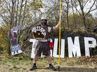 A contestant dressed as a viking version of President Trump poses for a portrait during a Trump campaign rally named "Trumptoberfest" at Rocky Point Park in Warwick, Rhode Island on October 11, 2020. Many supporters dressed in political campaign clothing and waved flags while others dressed in festive costumes to take part in a political costume contest. Joseph Prezioso / AFP