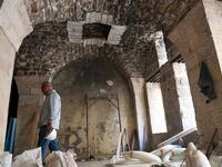 Syrian workers take part in the reconstruction of Martini restaurant and hotel in the Jdaideh neighbourhood in Aleppo's Old City on October 17, 2020. AFP