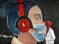 A Palestinian student paints a mural of a mask-clad girl in Gaza City on October 22, 2020, amid the novel coronavirus pandemic crises. Mohammed ABED / AFP
