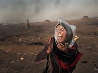 A Palestinian woman screams during a protest against the Israel siege of Gaza Strip at Gaza’s Eastern border, May 2018. Plastic bags are used by demonstrators to protect themselves against teargas.⁣ From ‘The Great March of Return’ by Fabio Bucciarelli (@fabio_bucciarelli) for Yahoo News (@yahoonews).⁣ ⁣ (Instagram)
