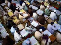 AFP Photo DOCUMENT REFERENCE000_8TL4C7 SLUGPAKISTAN - AFGHANISTAN - CONFLICT - ISLAM CREATION DATE10/19/2020 CITY/COUNTRYAKORA KHATTAK, PAKISTAN CREDITABDUL MAJEED / AFP FILE SIZE/PIXELS/DPI46.25 Mb / 4928 x 3280 / 300 dpi SPECIAL INSTRUCTIONSTO GO WITH 'PAKISTAN-AFGHANISTAN-CONFLICT-ISLAM - FOCUS' BY DAVID STOUT PAKISTAN-AFGHANISTAN-CONFLICT-ISLAM In this picture taken on October 19, 2020 Islamic seminary students attend class at the Darul Uloom Haqqania seminary in Akora Khattak. The Darul Uloom Haqqania 