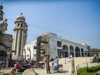 In this picture taken on October 19, 2020 Islamic seminary students stand outside the Darul Uloom Haqqania seminary in Akora Khattak. The Darul Uloom Haqqania seminary has churned out a who's who of Taliban top brass -- including many now on the hardline group's negotiating team holding talks with the Kabul government to end a 20-year war. Abdul MAJEED / AFP