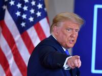 US President Donald Trump gestures after speaking during election night in the East Room of the White House in Washington, DC, early on November 4, 2020. MANDEL NGAN / AFP