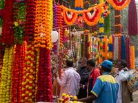 People buy decorations for Diwali, the Hindu Festival of Lights, from a stall in a market area in New Delhi on November 14, 2020. Jewel SAMAD / AFP