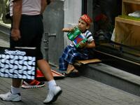A young street player collecting money in the center of Istanbul - Taksim Square/Photo by by Ewelina Lepionko