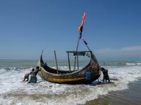 In this photograph taken on October 10, 2020, fishermen set out on a fishing boat at Sabrang beach area, a boarding point of Rohingya refugees migrating to Malaysia by boat. Boatloads of Rohingya landing across Southeast Asia are victims of complex human trafficking networks run by a dizzying web of players, from crime bosses and corrupt cops to poor fishermen, rickshaw drivers and even Rohingya themselves. Munir UZ ZAMAN / AFP