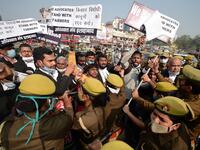Members of All India lawyers union scuffle with police during a protest in support of the nationwide general strike called by farmers against the recent agricultural reforms in Allahabad on December 8, 2020. SANJAY KANOJIA / AFP