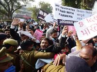 Members of All India lawyers union scuffle with police during a protest in support of the nationwide general strike called by farmers against the recent agricultural reforms in Allahabad on December 8, 2020. SANJAY KANOJIA / AFP
