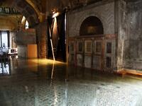 A view shows the flooded entrance of St. Mark's Basilica on December 8, 2020 in Venice following a high tide "Alta Acqua" event following heavy rains and strong winds, and the mobile gates of the MOSE Experimental Electromechanical Module that protects the city of Venice from floods, were not lifted ANDREA PATTARO / AFP