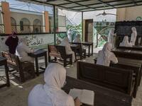 This picture taken during a government-guided tour on December 27, 2020 shows inmates attending a literacy class at al-Qanatir women's prison, at the tip of the Nile delta in Qalyoubiya province, about 30 kilometres north of Egypt's capital. Khaled DESOUKI / AFP