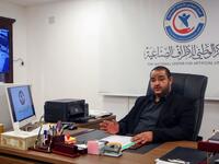 Director of the National Center for Artificial Limbs Al-Sadeq Al-Haddad, speaks during an interview at his office in Libya's port city of Misrata, on December 17, 2020. MAHMUD TURKIA / AFP