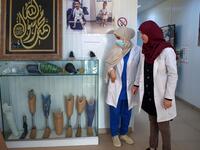 Members of staff work at the National Center for Artificial Limbs, in Libya's port city of Misrata, on December 17, 2020. With Libya's health sector left in tatters by its multiple conflicts since the 2011 revolution, war-wounded Libyans are often sent abroad for treatment, at the expense of the state. However, A national centre for prostheses, being established in Misrata, already has a patient waiting list of more than 3,000 amputees