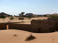 This picture taken on December 31, 2020, shows the walls of an abandoned house in the Omani village of Wadi al-Murr, about 400 kms (250 miles) southwest of the capital Muscat. Encroaching desert sands have left little evidence that Wadi al-Murr ever existed, but former inhabitants, while resigned to its destruction, are trying to preserve its memory. MOHAMMED MAHJOUB / AFP
