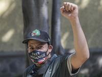 A Mexican activist takes part in a protest in front of the British embassy to demand the freedom of Wikileaks founder Julian Assange, in Mexico City, on January 4, 2021. After British justice denied the US extradition request, Mexican president Andres Manuel Lopez Obrador offered political asylum to Assange. Pedro PARDO / AFP