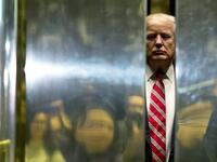 AFP presents a retrospective photo package of 60 pictures marking the 4-year presidency of President Trump. US President-elect Donald Trump boards the elevator after escorting Martin Luther King III to the lobby after meetings at Trump Tower in New York City on January 16, 2017. DOMINICK REUTER / AFP