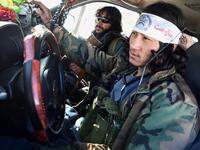 In this photo taken on January 9, 2021, Hazara armed militia for the Resistance for Justice Movement, sit in a car in front of their base during a patrol against Taliban insurgents at Hisa-e-Awali Behsud district of Maidan Wardak Province. Comprising roughly 10 to 20 percent of Afghanistan's 38-million population, Hazaras have long been persecuted for their largely Shiite faith by Sunni hardliners in a country wracked by deep ethnic divisions. WAKIL KOHSAR / AFP
