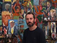 Israeli painter Iddo Markus poses for a picture at his studio, surrounded by his paintings of former US president Donald Trump, in the northern port city of Haifa, on January 22, 2021. Markus became fascinated by the "tragic figure" of Donald Trump, and the walls and floor of his studio are packed with some 120 portraits of the former US presidents. Emmanuel DUNAND / AFP