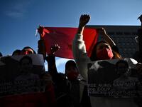 A group pf Myanmar activists chant slogans during a protest outside the United Nations university building in Tokyo on February 1, 2021 following a military coup in the country by a general after arresting civilian leader Aung San Suu Kyi and other senior officials. Philip FONG / AFP