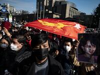 Myanmar activists chant slogans during a protest outside the United Nations University building in Tokyo on February 1, 2021, after Myanmar's military seized power in a bloodless coup and detaining democratically elected leader Aung San Suu Kyi as it imposed a one-year state of emergency. Philip FONG / AFP
