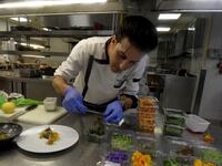 Tunisian chef Bassem Bizid uses edible flowers to prepare his dishes at a luxury hotel in Gammarth, an upscale northern suburb of the capital Tunis, on February 5, 2021. FETHI BELAID / AFP