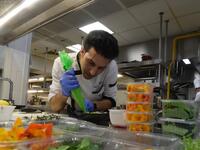 Tunisian chef Bassem Bizid uses edible flowers to prepare his dishes at a luxury hotel in Gammarth, an upscale northern suburb of the capital Tunis, on February 5, 2021. Tunisians already use certain flowers in their traditional cuisine. Some sweets feature dried rose petals, while lavender is an ingredient in a spice mix used in couscous recipes. But fresh flowers, which can be used for dishes from soups to salads as well as teas, are a novelty.  FETHI BELAID / AFP