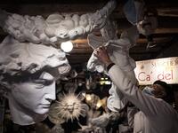 Mask artisan Hamid Seddighi adjusts a xreation in his laboratory 'Ca del Sol' in Venice on February 6, 2021, as the traditional Venice carnival is being cancelled due to the Covid-19 pandemic. Marco Bertorello / AFP