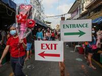 People buy flowers at a market in Manila on Valentine's Day on February 14, 2021. Jam STA ROSA / AFP