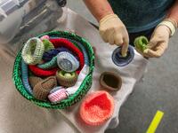 Volunteer at Wildlife Rehabilitation Ireland, Joan Scully sorts through knitted nests for injured birds donated by members of the public, at their new premises situated behind the Tara na Ri Pub, which is shuttered due to the Covid-19 pandemic, at Garlow Cross outside Navan in County Meath, Ireland on February 18, 2021. Since Ireland's first coronavirus lockdown pub the Tara Na Ri has been closed to regulars, but now it hosts a menagerie of new clientèle as the nation's first wildlife hospital. PAUL FAITH /