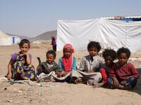 Yemeni children sit at the Jaw al-Naseem camp for internally displaced people on the outskirts of the northern city of Marib, on February 18, 2021 in the Saudi-backed Yemeni government's last northern bastion. Until early last year, life in Marib city was relatively peaceful despite the Yemen's civil war that erupted in 2014. The United Nations warned last week of a potential humanitarian disaster if the fight for Marib continues, saying it has put "millions of civilians at risk". More than 3.3 million have