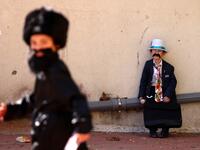 Israelis dressed in costumes in celebration of the Jewish holiday of Purim are pictured in the ultra-Orthodox neighborhood of Bnei Brak, on February 26, 2021. Israel imposed a night-time curfew for three nights from yesterday evening to curb the spread of the coronavirus during the Jewish holiday of Purim, the government said. The curfew, from 8:30 pm to 5:00 am daily (1830 GMT to 0300 GMT), will be in force from Thursday night until Sunday morning, a joint statement from the prime minister's office and the