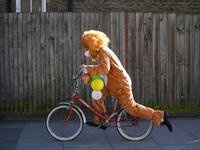 A reveller dressed in costume in celebration of the Jewish holiday of Purim, cycles along a street in the Orthodox Jewish neighborhood of Stamford Hill in north London on February 26, 2021. The carnival-like Purim holiday is celebrated with parades and costume parties to commemorate the deliverance of the Jewish people from a plot to exterminate them in the ancient Persian Empire 2,500 years ago, as recorded in the Biblical Book of Esther. DANIEL LEAL-OLIVAS / AFP