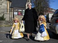 Young children dressed in costume in celebration of the Jewish holiday of Purim, are escorted along a street in the Orthodox Jewish neighborhood of Stamford Hill in north London on February 26, 2021. The carnival-like Purim holiday is celebrated with parades and costume parties to commemorate the deliverance of the Jewish people from a plot to exterminate them in the ancient Persian Empire 2,500 years ago, as recorded in the Biblical Book of Esther. DANIEL LEAL-OLIVAS / AFP