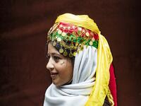 A Syrian Kurdish woman in traditional attire 
