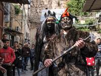 Carnival participants dressed in costume and wearing body paint 