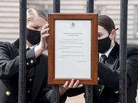 An official notice announcing the death of Britain's Prince Philip, Duke of Edinburgh is placed on the gates of Buckingham Palace 