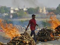Funeral pyres burn as the last rites are performed of the patients who died of the Covid-19 coronavirus at a cremation ground in Allahabad 