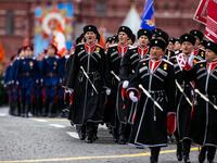 Cossacks march along Red Square during the Victory Day military parade in Moscow on May 9, 2021. Russia celebrates the 76th anniversary of the victory over Nazi Germany during World War II