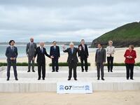 L-R) Canada's Prime Minister Justin Trudeau, President of the European Council Charles Michel, US President Joe Biden, Japan's Prime Minister Yoshihide Suga, Britain's Prime Minister Boris Johnson, Italy's Prime minister Mario Draghi, France's President Emmanuel Macron, President of the European Commission Ursula von der Leyen and Germany's Chancellor Angela Merkel pose for the family photo at the start of the G7 summit in Carbis Bay, Cornwall on June 11, 2021. G7 leaders from Canada, France, Germany, Italy