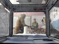 A woman signs a voter registry after casting her ballot at a polling station in Bouchaoui, on the western outskirts of Algeria's capital Algiers, on June 12, 2021 during the 2021 parliamentary elections. Polls opened in Algeria for a parliamentary election overshadowed by a crackdown on a long-running protest movement that has campaigned for a mass boycott. Pro-government parties have urged a big turnout for the "crucial vote" which they hope will restore stability after two years of turmoil since the force
