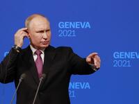 Russia's President Vladimir Putin holds a press conference after meeting with US President in Geneva 
