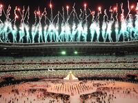 Fireworks go off around the Olympic Stadium after the lighting of the Olympic Flame during the opening ceremony of the Tokyo 2020 Olympic Games