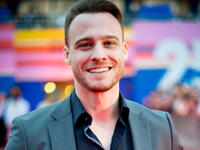 he wore a black shirt with a dark gray suit