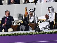 Qatar's former Emir Sheikh Hamad bin Khalifa al-Thani (2ndL) and Qatar's Emir Sheikh Tamim bin Hamad al-Thani waves a signed Qatari jersey next to Qatar's Emir Sheikh Tamim bin Hamad al-Thani (R) and Abdullah II King of Jordan (L) during the opening ceremony ahead of the Qatar 2022 World Cup 