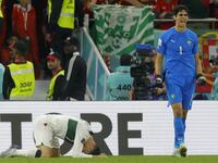 Morocco's goalkeeper #01 Yassine Bounou and Portugal's forward #07 Cristiano Ronaldo react during the Qatar 2022 World Cup quarter-final football match between Morocco and Portugal at the Al-Thumama Stadium in Doha on December 10, 2022. (Photo by Odd ANDERSEN / AFP)