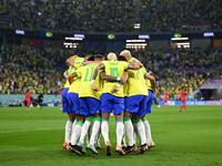 Brazil's forward #10 Neymar (C) celebrates with teammates after he scored his team's second goal from the penalty spot during the Qatar 2022 World Cup round of 16 football match between Brazil and South Korea at Stadium 974 in Doha on December 5, 2022. (Photo by MANAN VATSYAYANA / AFP)