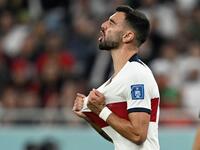 Portugal's midfielder #08 Bruno Fernandes reacts after missing a goal opportunity during the Qatar 2022 World Cup quarter-final football match between Morocco and Portugal at the Al-Thumama Stadium in Doha on December 10, 2022. (Photo by PATRICIA DE MELO MOREIRA / AFP)