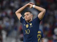 France's forward #10 Kylian Mbappe celebrates scoring his team's third goal during the Qatar 2022 World Cup round of 16 football match between France and Poland at the Al-Thumama Stadium in Doha on December 4, 2022. (Photo by FRANCK FIFE / AFP)