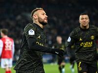 Paris Saint-Germain's Brazilian forward Neymar celebrates after scoring the opening goal during the French L1 football match between Paris Saint-Germain (PSG) and Stade de Reims at the Parc des Princes stadium in Paris on January 29, 2023. (Photo by Anne-Christine POUJOULAT / AFP)